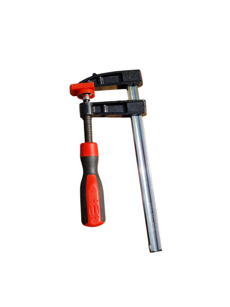 Zwarte lijmklem met rood en zwart kunststof handvat.